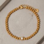 Ball bead CZ accent stainless steel bracelet gold finish - UK