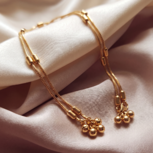 Golden rhythm anklet cylindrical bead Impon Panchaloha - SunShoppers UK