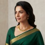 Antique gold-tone coin necklace with kemp-style stone accents and matching jhumka earrings
