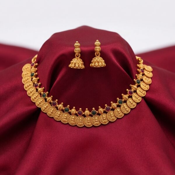 Antique gold-tone coin necklace with kemp-style stone accents and matching jhumka earrings