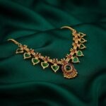 Gold-tone green enamel leaf motif necklace with pink stone detailing – SunShoppers UK