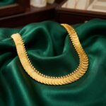 Gold-tone single row Kasu coin necklace on display bust – SunShoppers UK