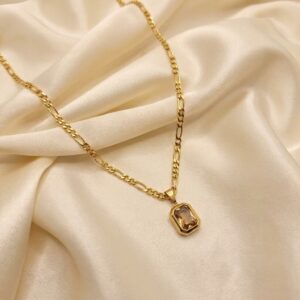 Gold-tone pendant necklace with brown emerald-cut crystal stone