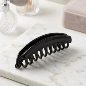 Glossy black acetate hair claw clip on marble surface – SunShoppers UK