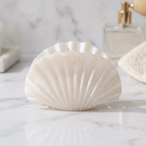 Cream shimmer seashell hair claw clip on marble surface – SunShoppers UK