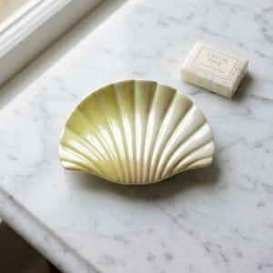 Yellow and cream seashell hair claw clip on marble surface – SunShoppers UK