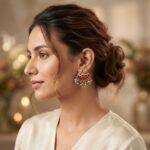 Gold-tone swan stud earrings with ruby-coloured jadau-style panel, green and pink bead drops and faux pearls