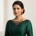 Gold-tone peacock necklace set with cubic zirconia, green and ruby-coloured stones, pearl-effect accents and matching drop earrings