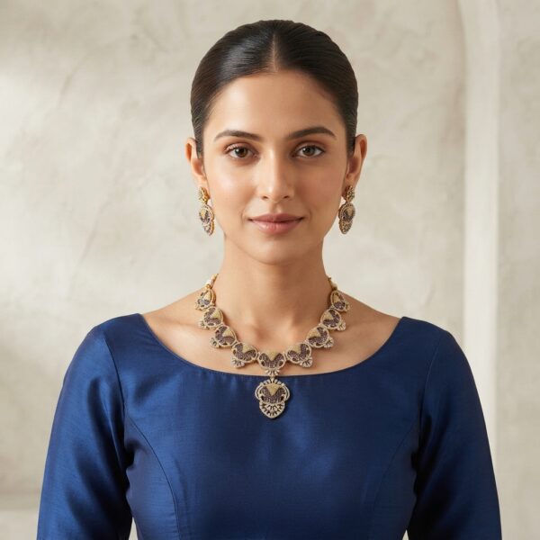 Gold-tone purple necklace set with openwork medallions, cubic zirconia, adjustable chain and matching drop earrings