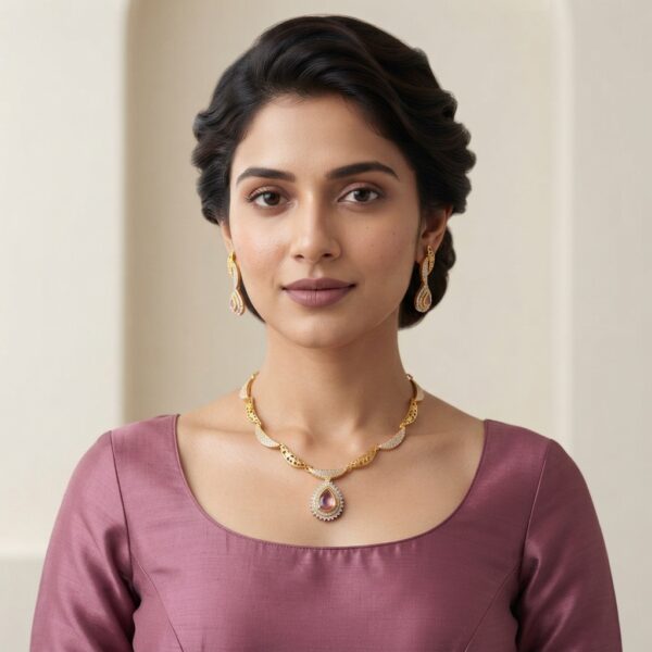 Gold-tone teardrop necklace set with cubic zirconia, blush-pink centre stones and matching drop earrings