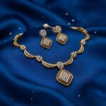 square pendant necklace set with scalloped neckline and matching drop earrings
