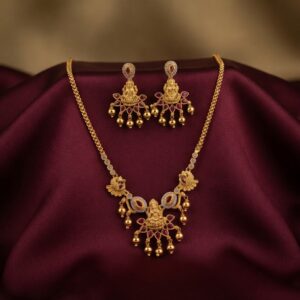 temple jewellery necklace set with Lakshmi motif pendant and gold-bead drop earrings