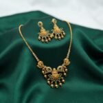 temple jewellery necklace set with Lakshmi motif pendant and gold-bead drop earrings