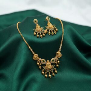 temple jewellery necklace set with Lakshmi motif pendant and gold-bead drop earrings
