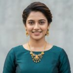 temple jewellery necklace set with Lakshmi motif pendant and gold-bead drop earrings