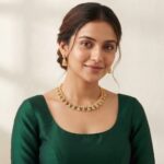 Gold-tone openwork wedding guest necklace set with cubic zirconia, ruby-coloured accents and matching triangular drop earrings