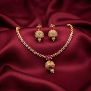 jhumka pendant necklace set with pearl-style drop and matching jhumka earrings