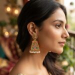 Antique gold-tone gopuram earrings with Lakshmi stud tops, coral pink and turquoise colour detail and faux pearl drops