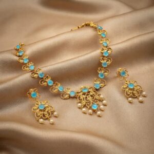 filigree necklace set with pearl-style drops and matching floral earrings