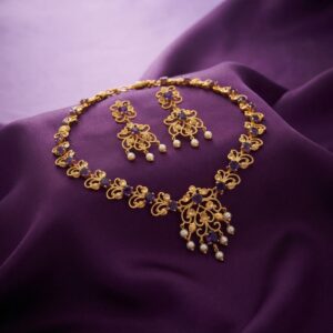 filigree necklace set with pearl-style drops and matching floral earrings