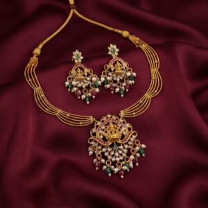 Lakshmi pendant necklace set with layered gold-tone chain and chandelier earrings
