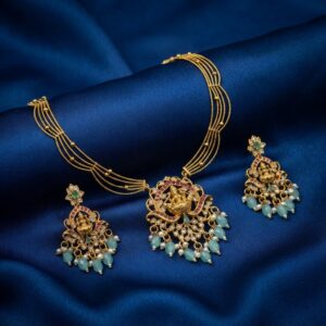 Lakshmi pendant necklace set with layered gold-tone chain and chandelier earrings