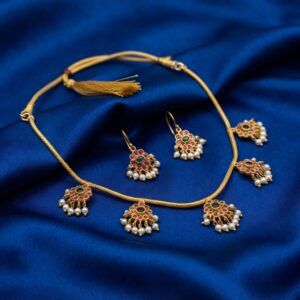 floral charm necklace set with pearl-style drops and hook earrings