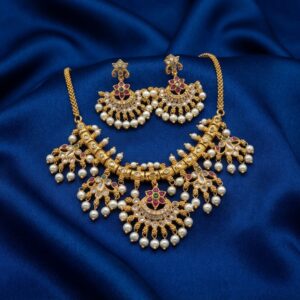 gold-tone necklace set with fan-shaped pearl-style drops and matching chandelier earrings