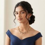 Gold-tone star necklace set with linked cubic zirconia starburst motifs and matching drop earrings