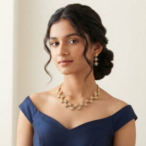 Gold-tone star necklace set with linked cubic zirconia starburst motifs and matching drop earrings
