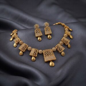 lattice necklace set with American diamond-style panels, teardrop drops and matching earrings