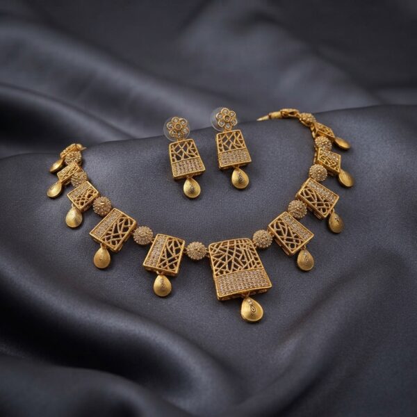 lattice necklace set with American diamond-style panels, teardrop drops and matching earrings