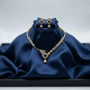 asymmetric necklace set with leaf pendant and matching drop earrings