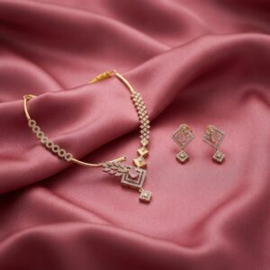 asymmetric necklace set with leaf pendant and matching drop earrings