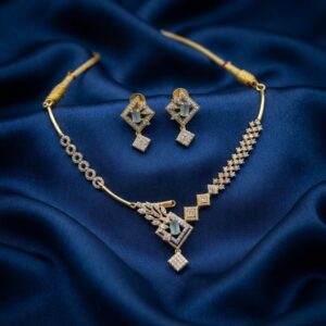 asymmetric necklace set with leaf pendant and matching drop earrings