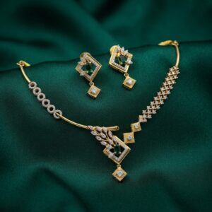 asymmetric necklace set with leaf pendant and matching drop earrings