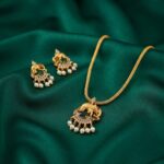 gold-tone elephant pendant necklace set with pearl-style drops and matching earrings