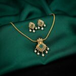gold-tone pearl drop pendant necklace set with square stone-style centre and matching earrings