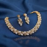 Clear gold-tone AD leaf necklace set with sparkling leaf clusters and matching drop earrings