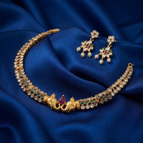 Antique gold-tone twin elephant choker necklace set with kundan-style stones and matching floral pearl-style drop earrings