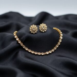 simple gold-tone Indian necklace set with floral stud earrings