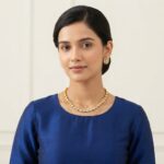 simple gold-tone Indian necklace set with floral stud earrings
