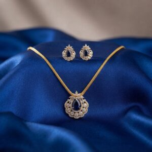 gold-tone halo pendant necklace set with American diamond-style floral detail and matching stud earrings