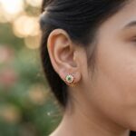 gold-tone floral stud earrings with American diamond-style halo and round centre stone