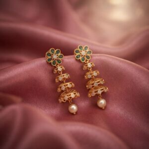 gold-tone tiered drop earrings with kundan-style floral top and pearl-style drop