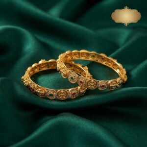 Pair of antique gold-tone Lakshmi coin bangles with temple-style discs and stone-style accents