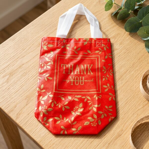 thank you gift bag with script lettering