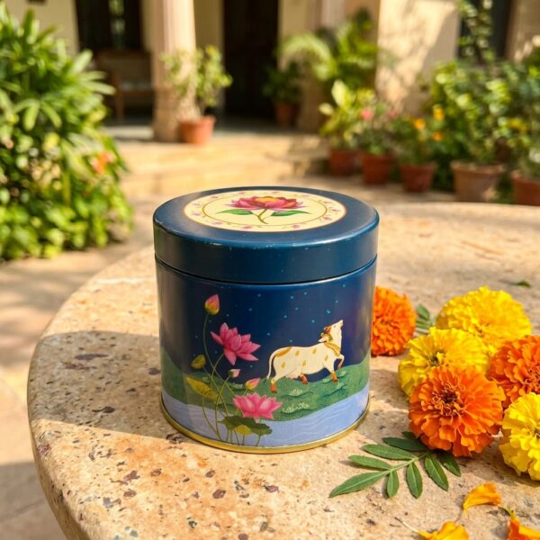 Pichwai-inspired decorative storage tin with cow and lotus artwork