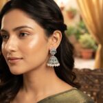 silver-tone cage jhumka earrings with AD-style floral top and pearl-style drops