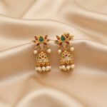 gold-tone lotus mini jhumka earrings with pink and green stone-style petals and pearl-style drops
